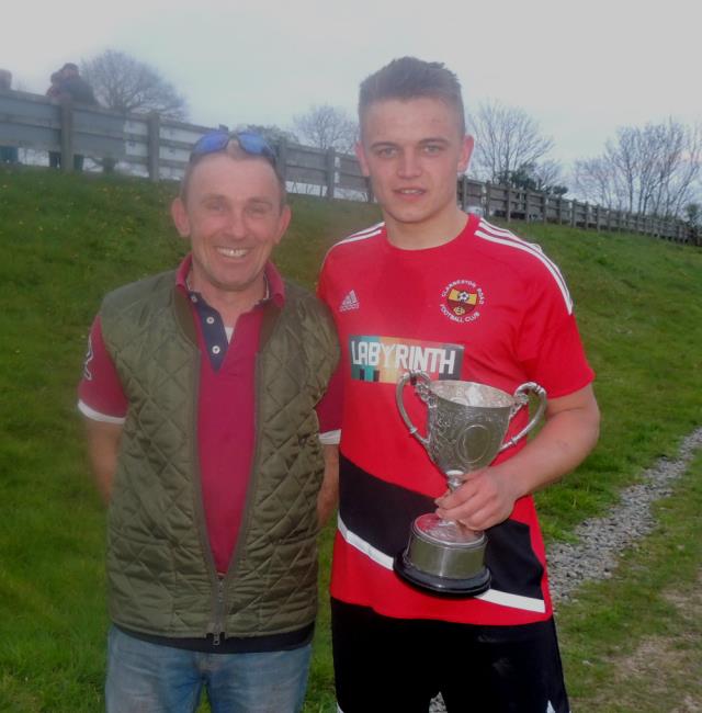 Father Steve and son Tom Glover with the cup